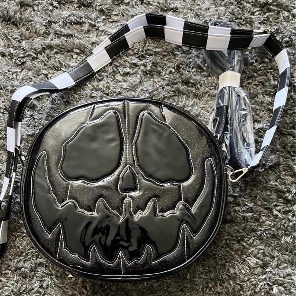Sold out, New and unused love pain and stitches black glitter bag.